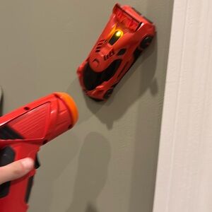 RC car controlled by laser and climbs on wall